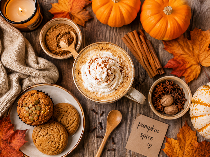 Pumpkin puree can with cinnamon sticks and autumn spices